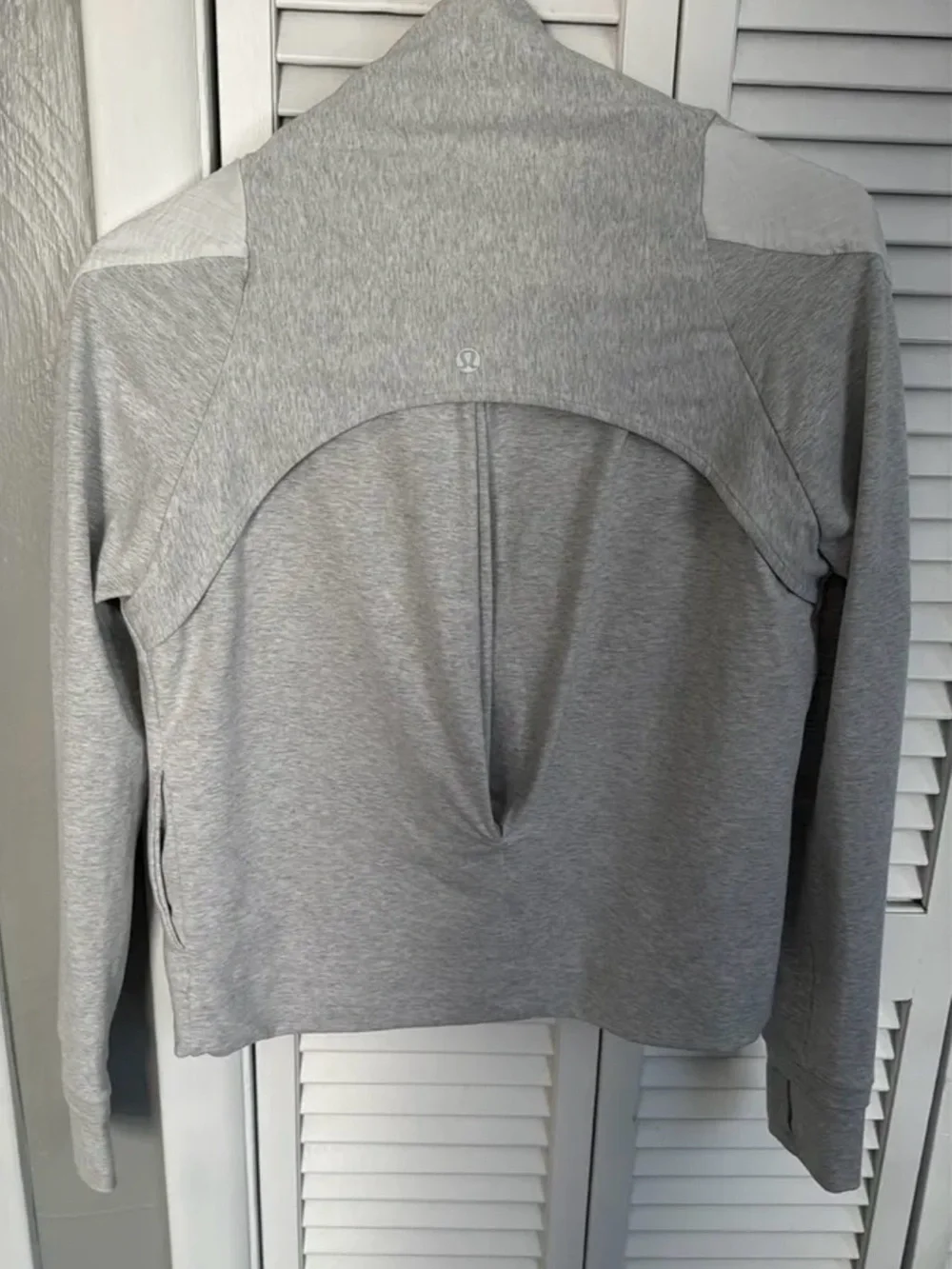 Lululemon Sway Moto Jacket in light gray and white.